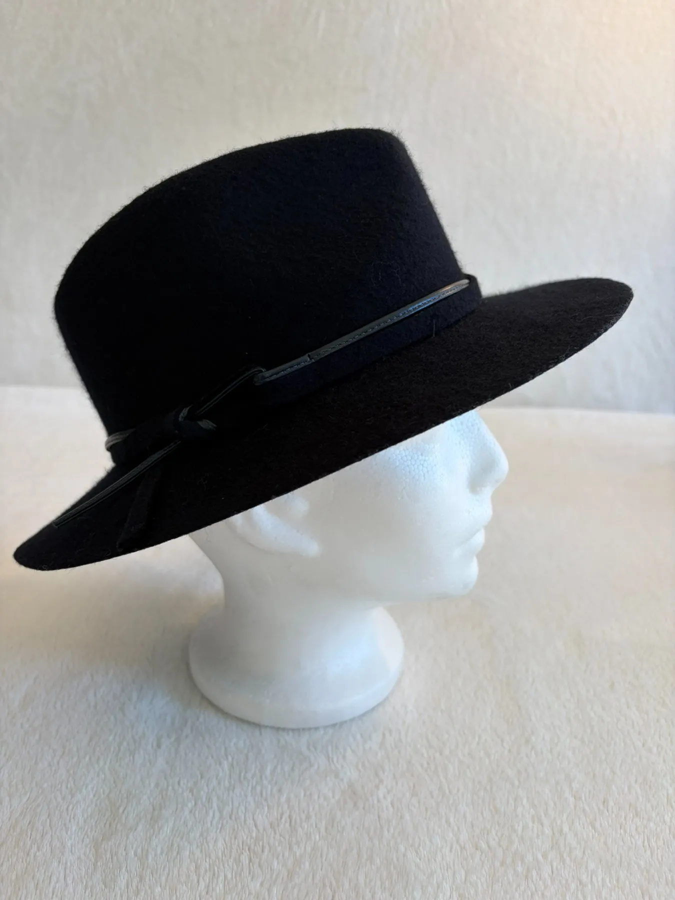 A navy felt cowboy hat from Hats by Cherish, number 225
