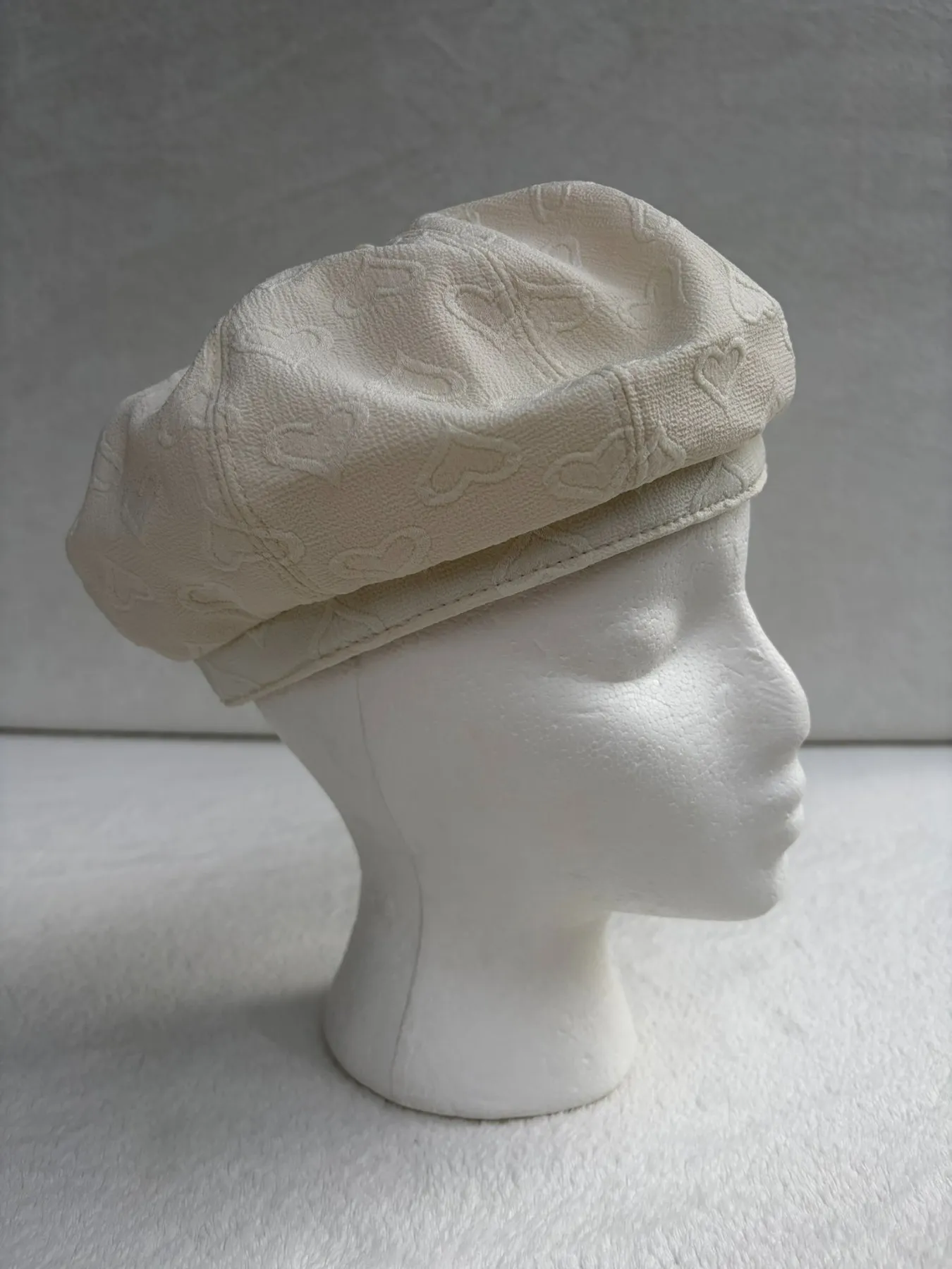 A cream beret from Hats by Cherish, number 322