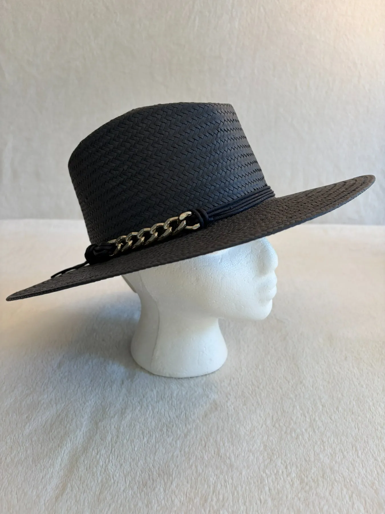 A navy straw cowboy hat from Hats by Cherish, number 324