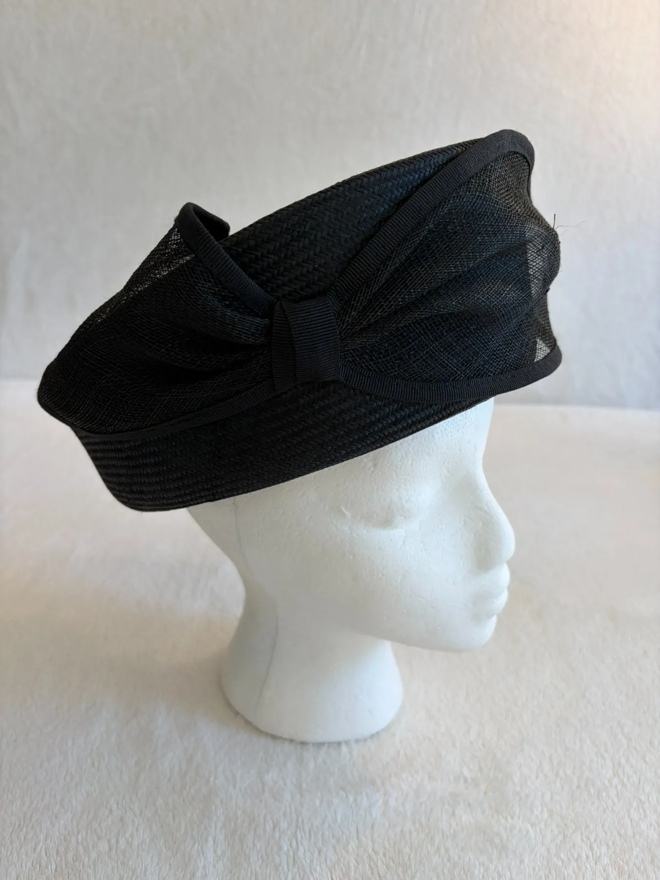 A black straw pillbox hat from Hats by Cherish, number 333
