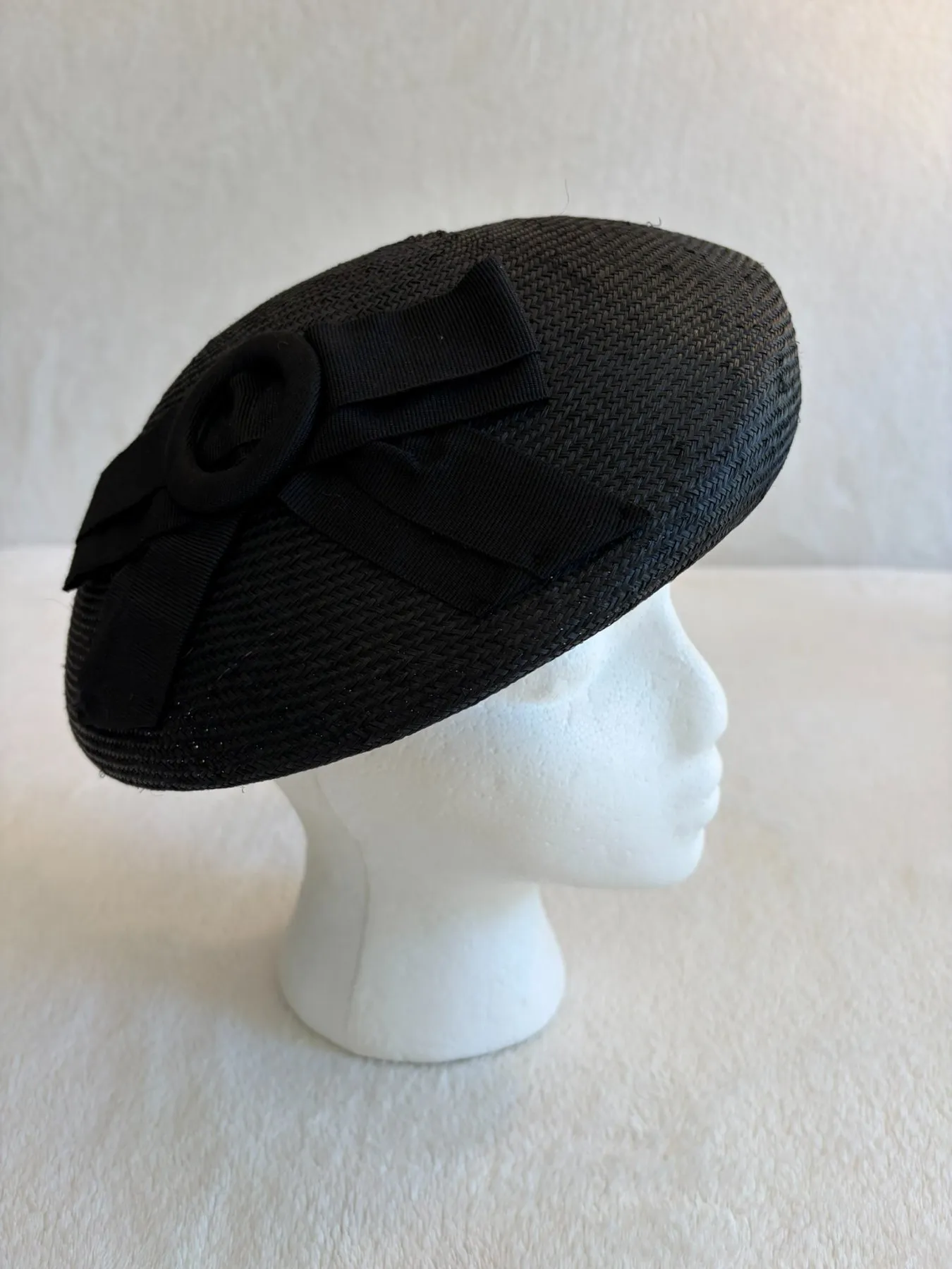 A black straw pillbox hat from Hats by Cherish, number 368