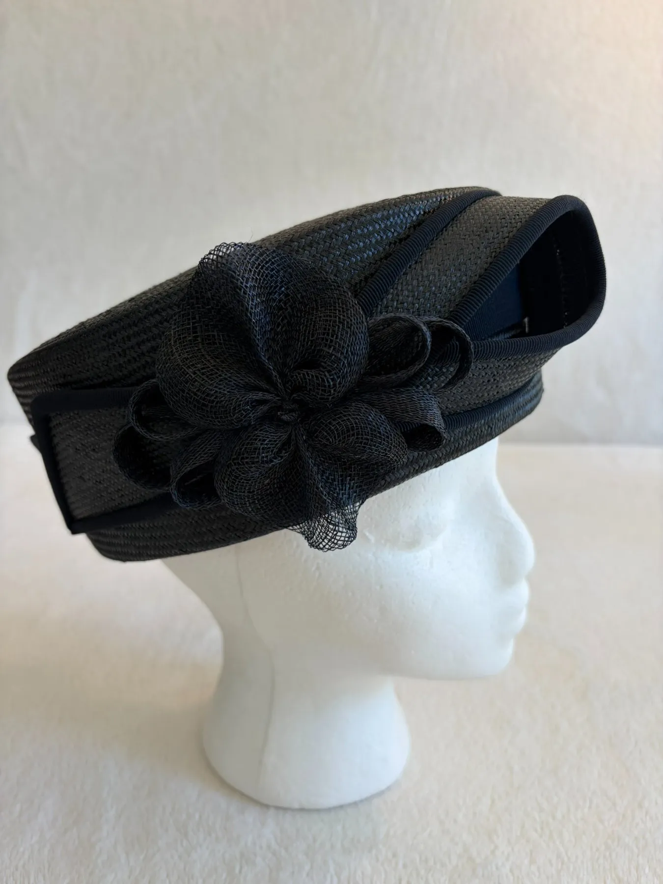 A navy straw pillbox hat from Hats by Cherish, number 374