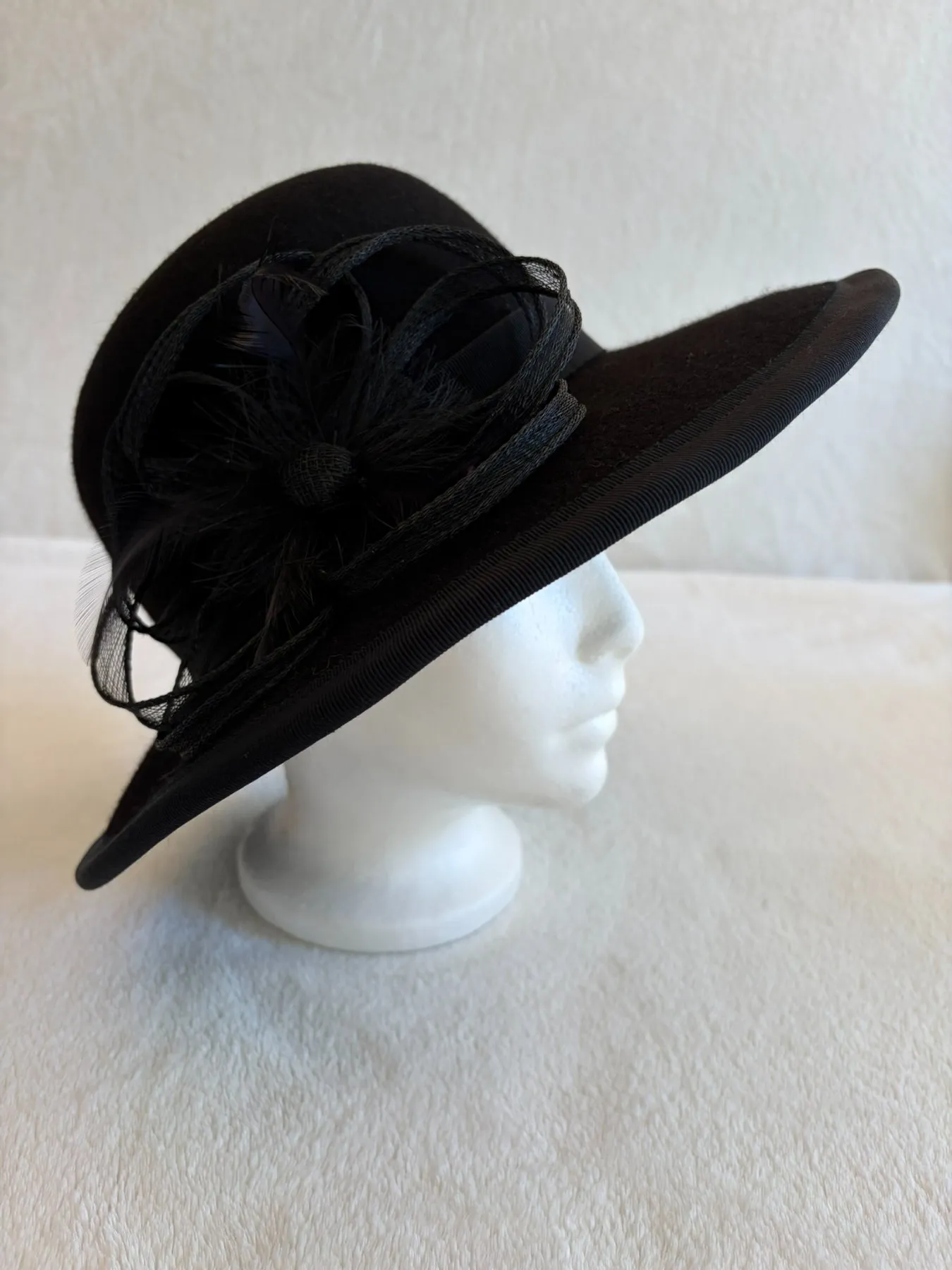 A black felt wide-brimmed hat from Hats by Cherish, number 385