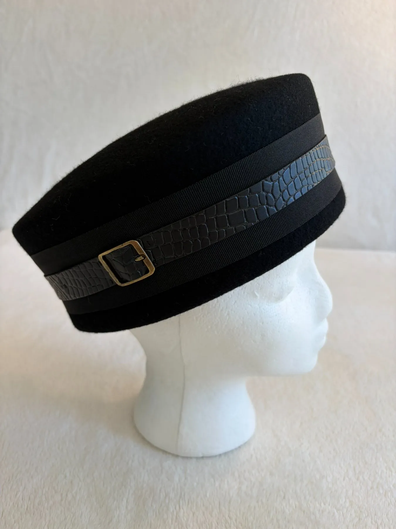 A black felt pillbox hat from Hats by Cherish, number 437
