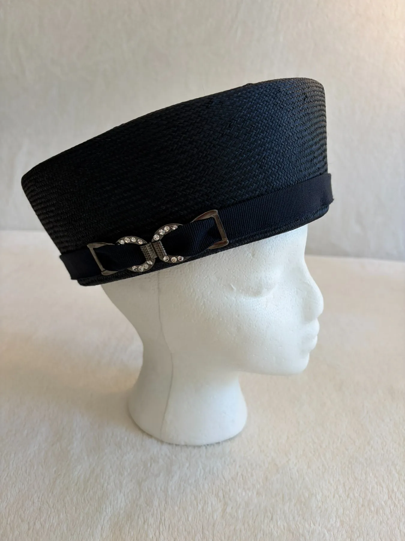 A navy straw pillbox hat from Hats by Cherish, number 438