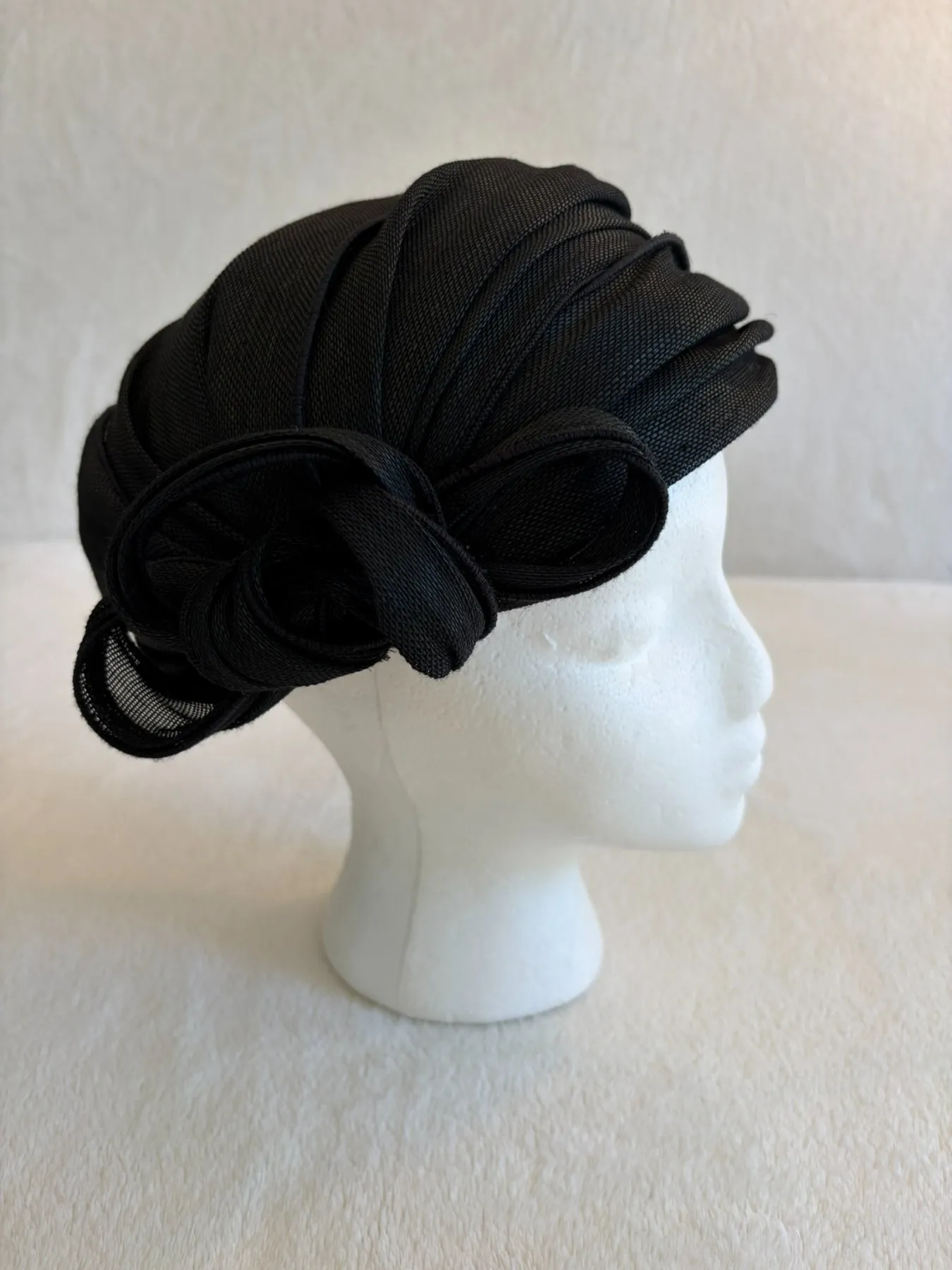 A black straw pillbox hat from Hats by Cherish, number 450