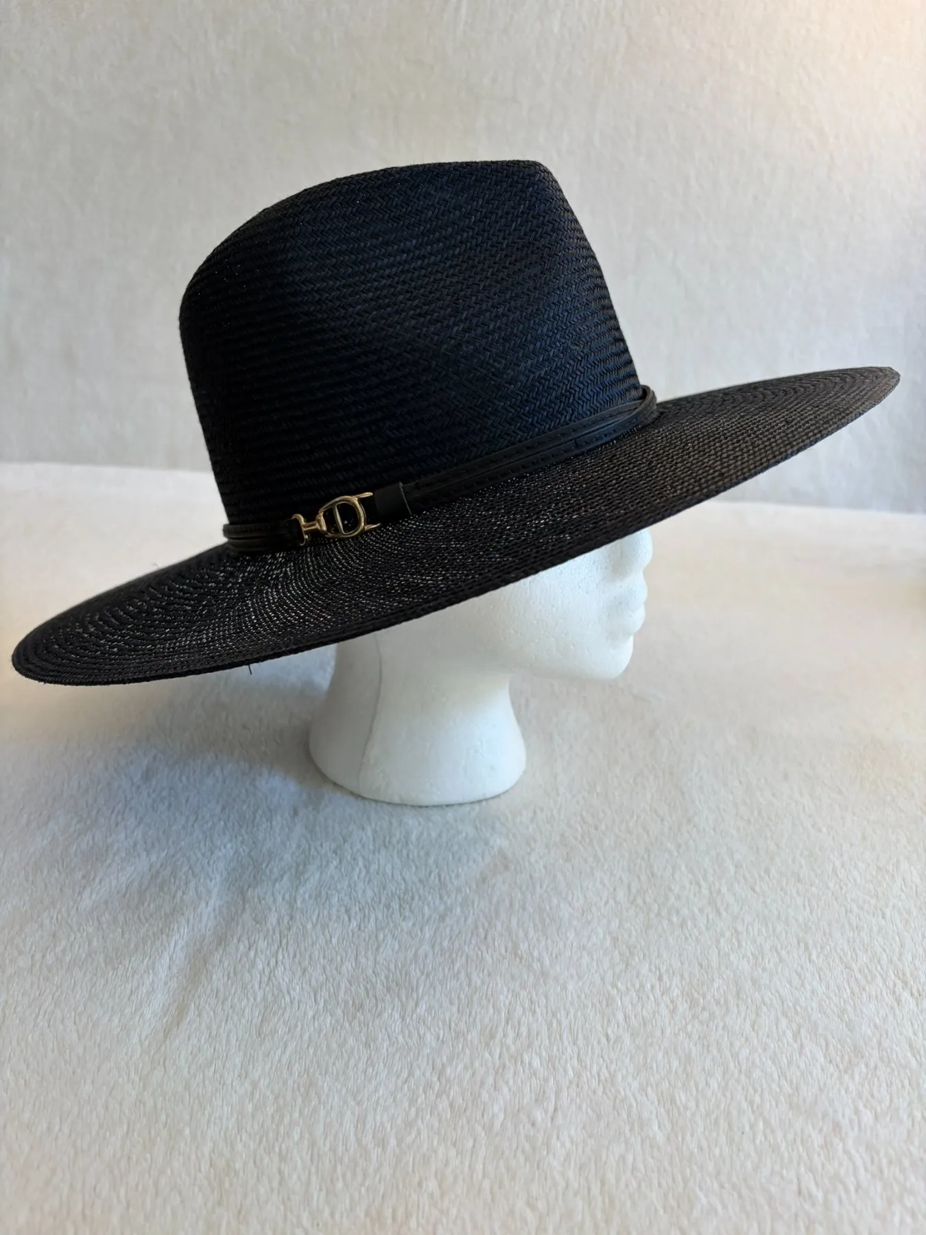A navy straw cowboy hat from Hats by Cherish, number 580