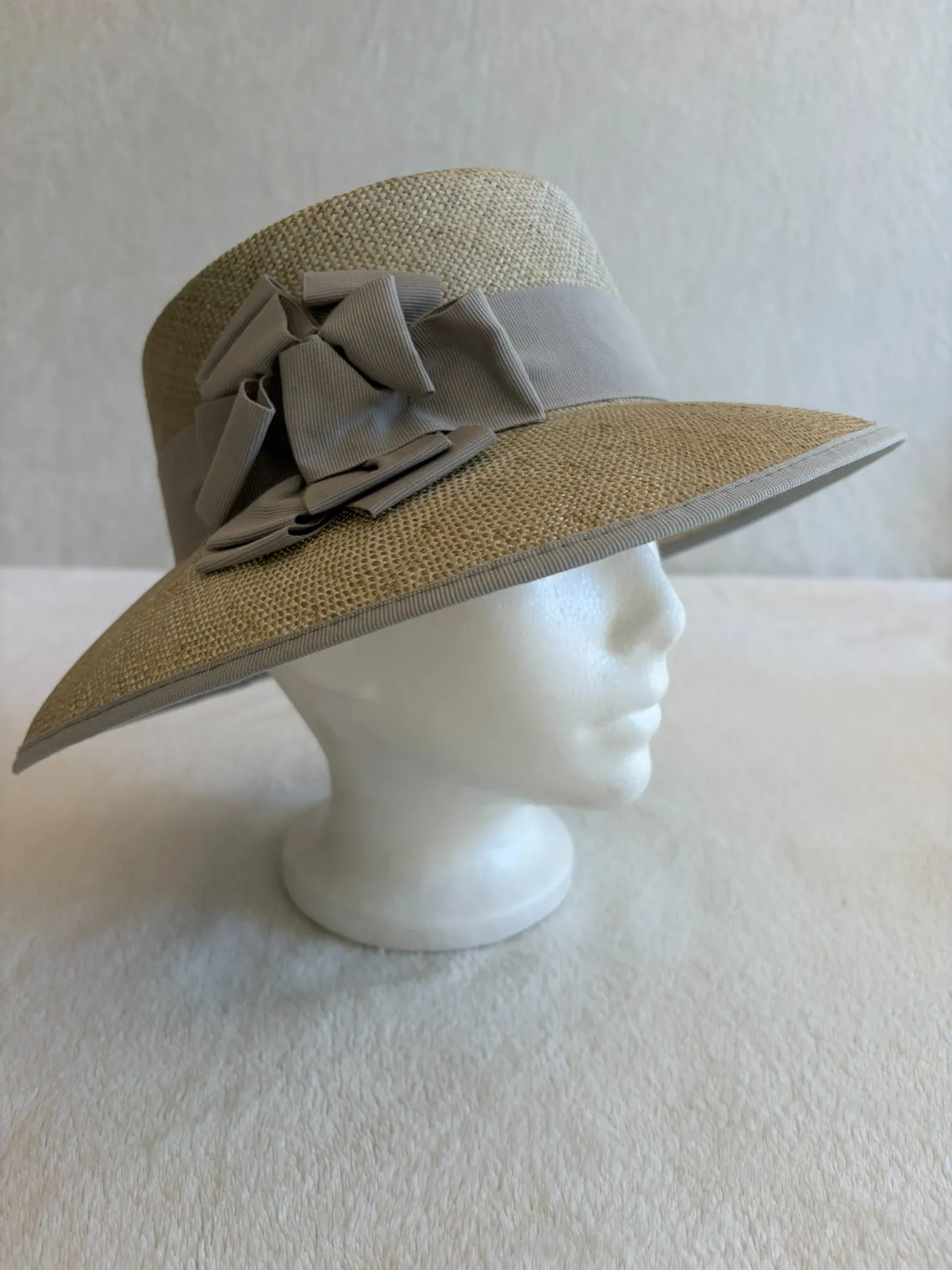 A blue straw wide-brimmed hat from Hats by Cherish, number 607