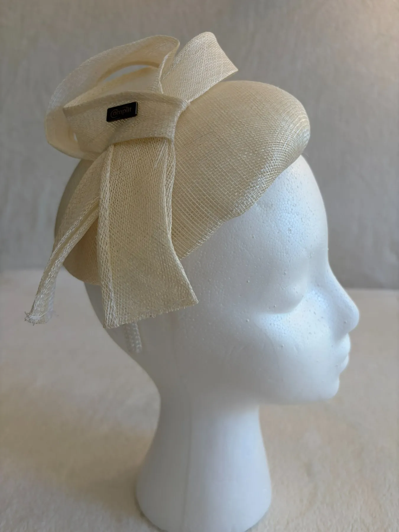 A cream straw fascinator from Hats by Cherish, number 643