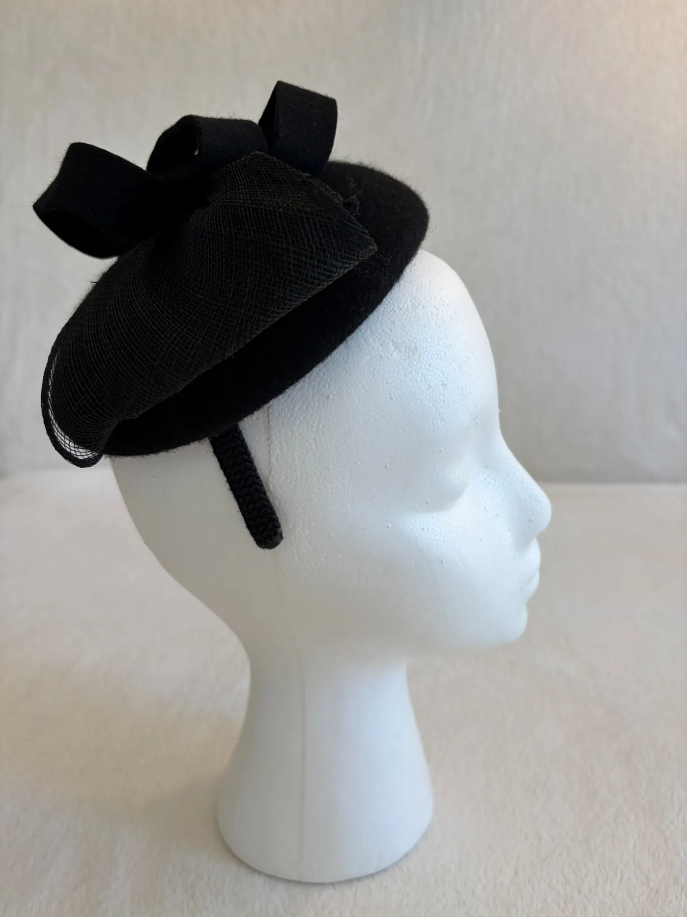 A black felt fascinator from Hats by Cherish, number 667