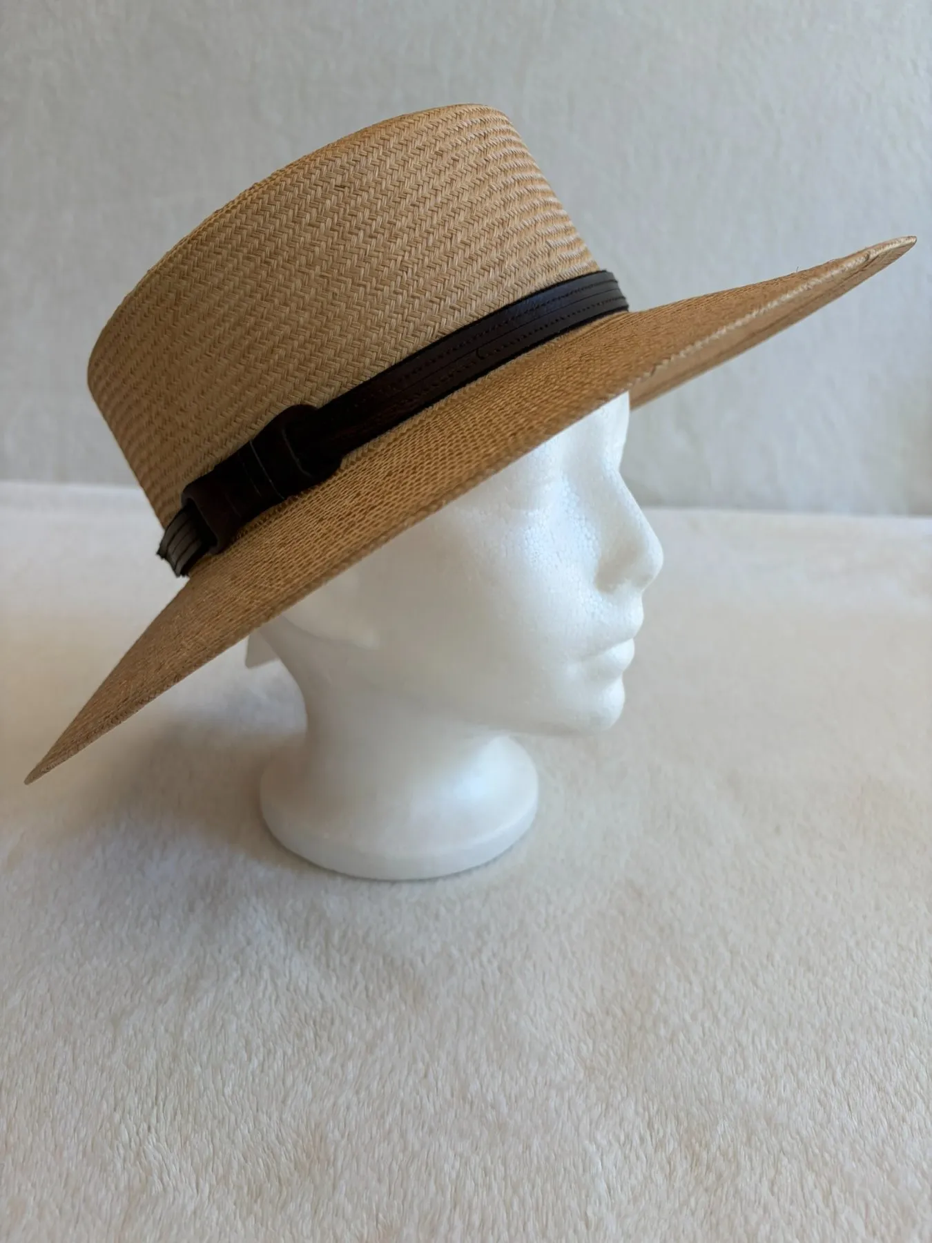 A beige and tan straw brimmed hat from Hats by Cherish, number 713